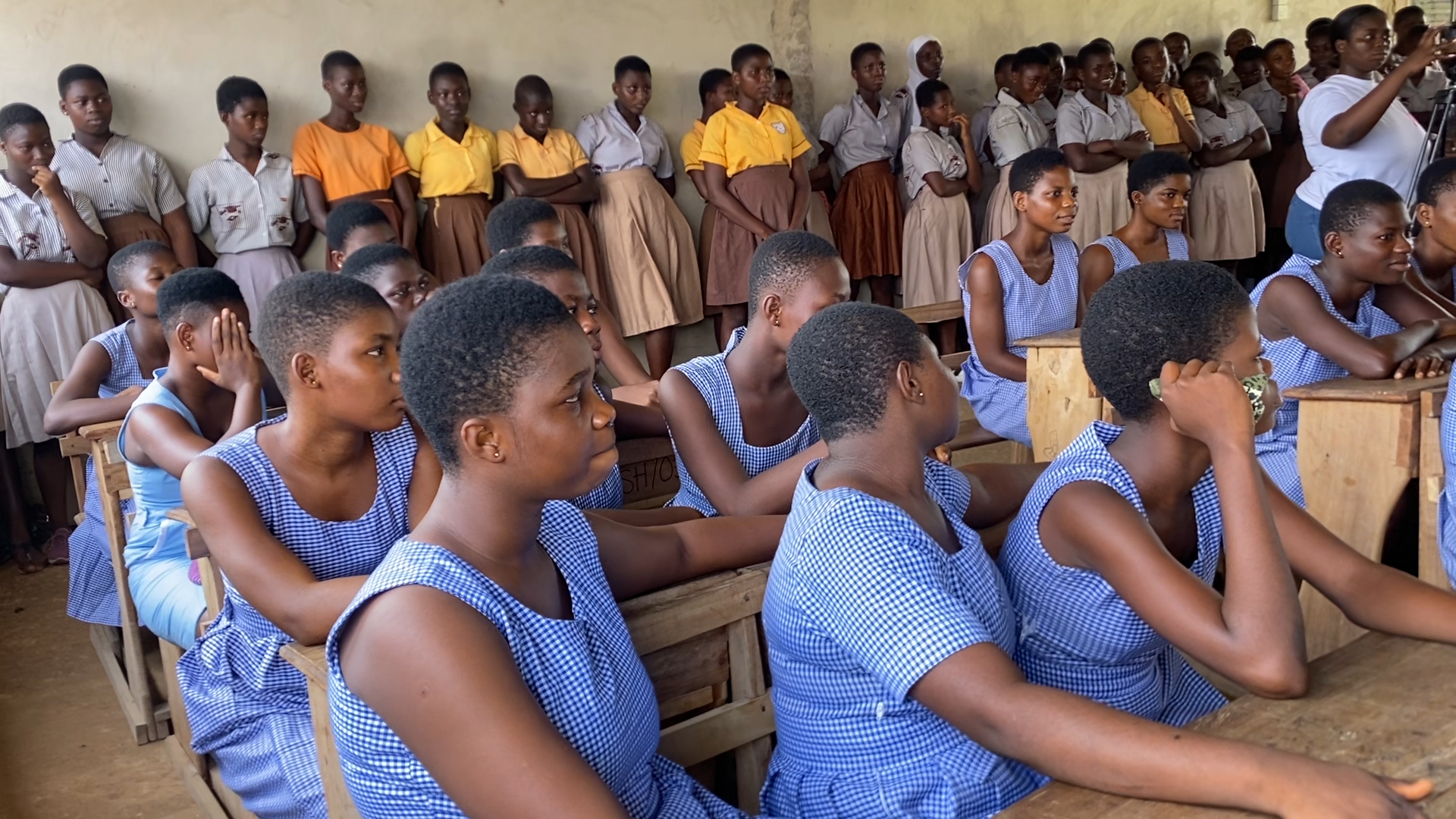 Students in Mfanteman listening to education on breast cancer